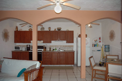 kitchen_7003.jpg - The kitchen is fully equipped with a refrigerator, propane gas stove, microwave, coffee maker, pots, pans and utensils.
